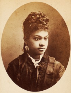 Oval quarter-length portrait of unidentified young woman, her bodice center trimmed..., c1870-c1879. Creators: Unknown, Moses Parker Rice.
