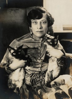 Tilla Durieux with two Siamese cats, 1920s. Creator: Stone, Sasha (1895-1940).