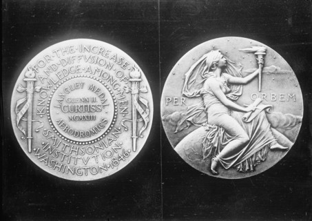 Langley Medal presented to aviator Glenn Hammond Curtiss, 1913. Creator: Harris & Ewing.