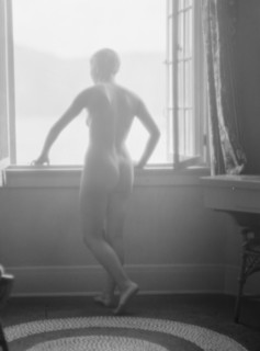 Lee, Margaret, Miss, standing at a window, 1927 Creator: Arnold Genthe.