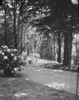 Leslie, Margeurite, and unidentified couple, walking in the woods, 1917 Aug. 18. Creator: Arnold Genthe.