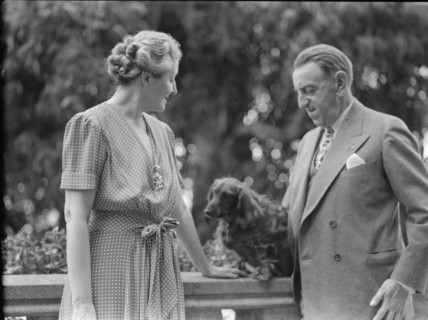 Alanson, Bertram, Mr. and Mrs., with dog, outdoors, between 1927 and 1937. Creator: Arnold Genthe.