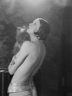 Carise, Erna, Mme., with dog, portrait photograph, 1928 Creator: Arnold Genthe.