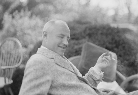 Clucas, E.W., seated outdoors, 1931 June 14. Creator: Arnold Genthe.