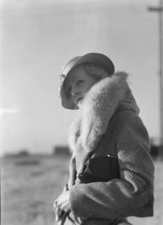 Hamilton, Esther, standing outdoors, 1933 May. Creator: Arnold Genthe.