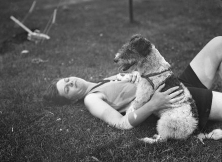 McKeogh, Arthur, Mrs., with dog, outdoors, 1927 Creator: Arnold Genthe.
