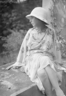 Stettheimer, Florine, Miss, seated outdoors, 1931 Aug. 19. Creator: Arnold Genthe.