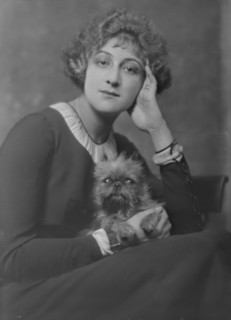 Melville, Mrs., with dog, portrait photograph, not before 1916. Creator: Arnold Genthe.