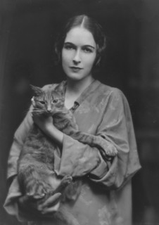 Pujo, Mona, Miss, with Buzzer the cat, portrait photograph, 1916. Creator: Arnold Genthe.