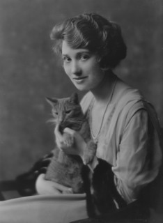 Bainter, Fay, Miss, with Buzzer the cat, portrait photograph, 1916. Creator: Arnold Genthe.