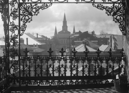 A vista through iron lace, New Orleans, between 1920 and 1926. Creator: Arnold Genthe.