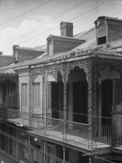 Upper story of building with wrought iron balconies, New Orleans, between 1920 and 1926. Creator: Arnold Genthe.