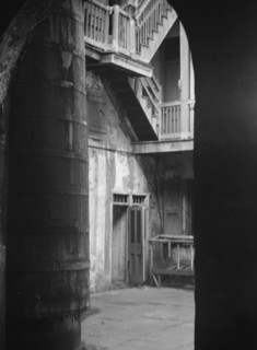 Cistern and outer stairs of an old-time courtyard, New Orleans, between 1920 and 1926. Creator: Arnold Genthe.