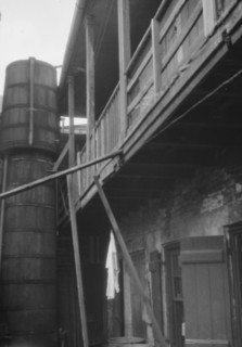 Courtyard with cistern, New Orleans, between 1920 and 1926. Creator: Arnold Genthe.