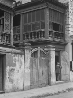 Multi-story house behind gated wall, New Orleans or Charleston, South Carolina, c1920-1926. Creator: Arnold Genthe.