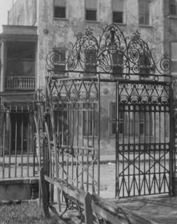 Park gate and houses, [36 Chalmers Street through Washington Park Gate], Charleston..., c1920-c1926. Creator: Arnold Genthe.