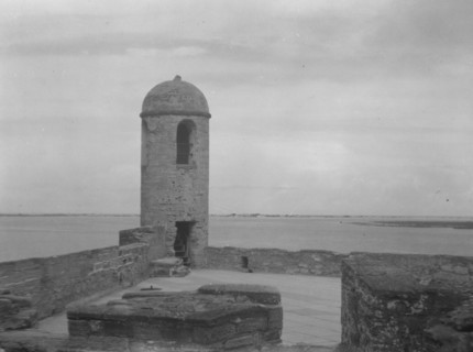 Walls and round tower by the water, Castillo de San Marcos, St. Augustine, Florida, c1920-c1926. Creator: Arnold Genthe.