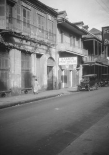 View down a street, New Orleans, between 1920 and 1926. Creator: Arnold Genthe.
