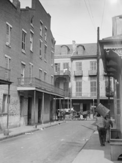View down a street, New Orleans, between 1920 and 1926. Creator: Arnold Genthe.