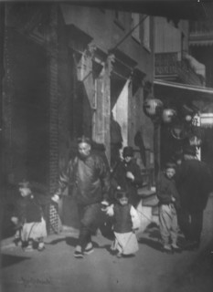 Man and two boys walking along a street, Chinatown, San Francisco, between 1896 and 1906. Creator: Arnold Genthe.
