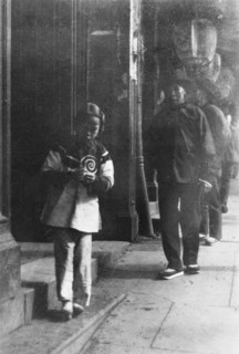 Young girl walking down a street, Chinatown, San Francisco, between 1896 and 1906. Creator: Arnold Genthe.