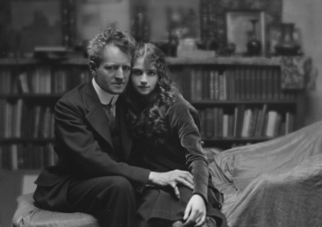 Arnold Genthe seated next to a woman friend in his studio in San Francisco, between 1896 and 1911. Creator: Arnold Genthe.