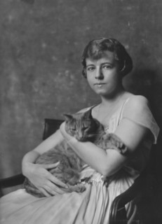 Miss Marjorie Cluett, with Buzzer the cat, portrait photograph, 1917 Dec. Creator: Arnold Genthe.