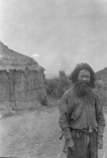 Ainu man standing outside, 1908. Creator: Arnold Genthe.