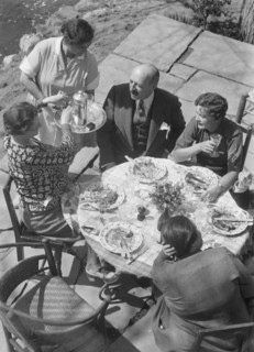 Mrs. Mary Benson and other people seated outdoors, 1933. Creator: Arnold Genthe.