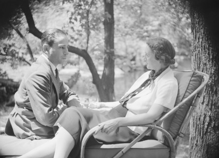 Mrs. Mary Benson and unidentified man, seated outdoors, 1933. Creator: Arnold Genthe.