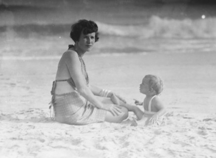 Mrs. George Eustis and child, at the beach, between 1911 and 1942. Creator: Arnold Genthe.