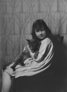 Daughter of Mrs. H Gamble, with cat, portrait photograph, 1917 Nov. 23. Creator: Arnold Genthe.