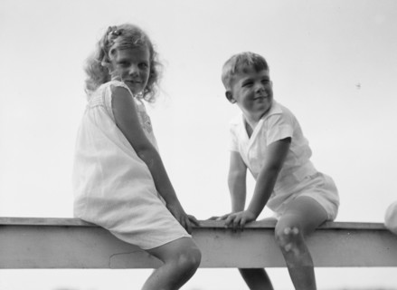 Kane children, seated on a fence, between 1911 and 1942. Creator: Arnold Genthe.