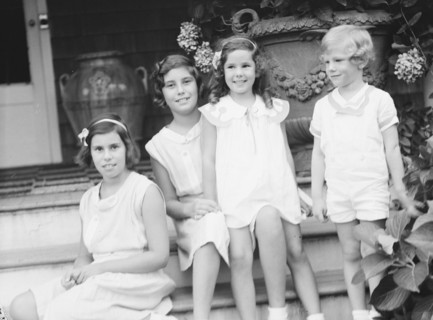 Children of W.G. Kimball, seated on the steps of their house, between 1911 and 1942. Creator: Arnold Genthe.