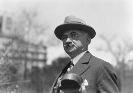 Dr. Maximilian Toch, standing outdoors, 1936. Creator: Arnold Genthe.