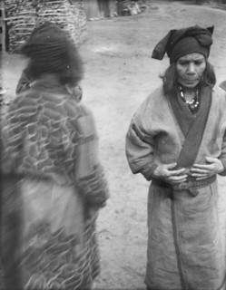 Two Ainu women in the village lane, 1908. Creator: Arnold Genthe.