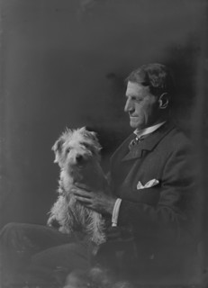 Mr. Arthur Young, with dog, portrait photograph, 1918 Oct. 1. Creator: Arnold Genthe.