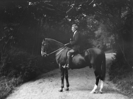Arnold Genthe riding Chesty, between 1911 and 1936. Creator: Arnold Genthe.