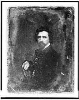 Thomas Hicks, half-length portrait, body in profile to left, facing front, between 1844 and 1860. Creator: Mathew Brady.