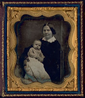 Lucy Stone, with Alice Stone Blackwell, half-length portrait of a woman, seated..., 1857 or 1858. Creator: Unknown.