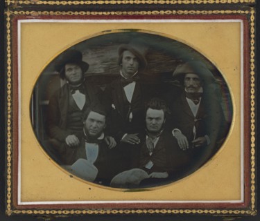 Five men posed at a fort or trading post, possibly at Scottsbluff, Nebraska..., ca. 1851-1852. Creator: Unknown.
