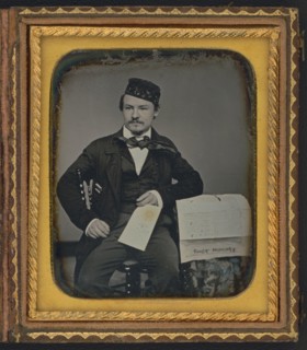 Portrait of seated man holding the Charleston Zeitung, possibly the owner of the newspaper..., 1853. Creator: Unknown.