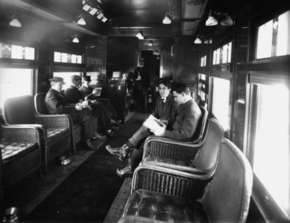 Buffet library car on a deluxe overland limited train, between 1910 and 1920. Creator: Unknown.