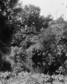 House above river, probably the Huron River, Ypsilanti, Mich., between 1900 and 1910. Creator: Unknown.