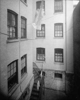 Court of tenement, New York City, between 1900 and 1910. Creator: Unknown.