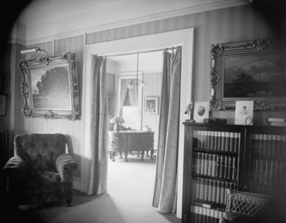 Room with bookcase, study with desk, between 1900 and 1915. Creator: Unknown.