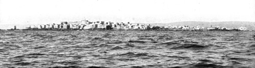 'Le drapeau Francais sur la cote Syrienne; L'ile Rouad, a 2 kilomtres de la cote..., 1915 (1924). Creator: Unknown.