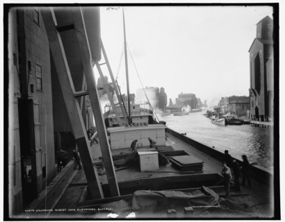 Unloading wheat into elevators, Buffalo, c1900. Creator: Unknown.