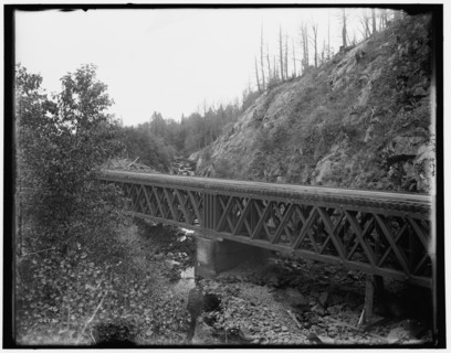 Montreal River, bridge at rock cut, Wisconsin, between 1880 and 1899. Creator: Unknown.