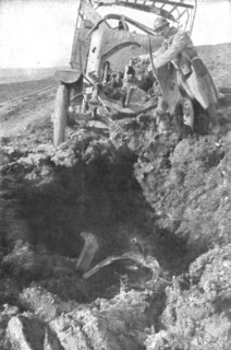 'Au Volant; Camion demoli, pres de Verdun, par un obus de 210: le radiateur detache est..., 1916. Creator: Unknown.